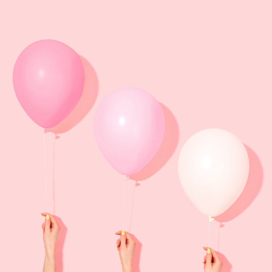 People with pink and white balloons - Sweet Escape